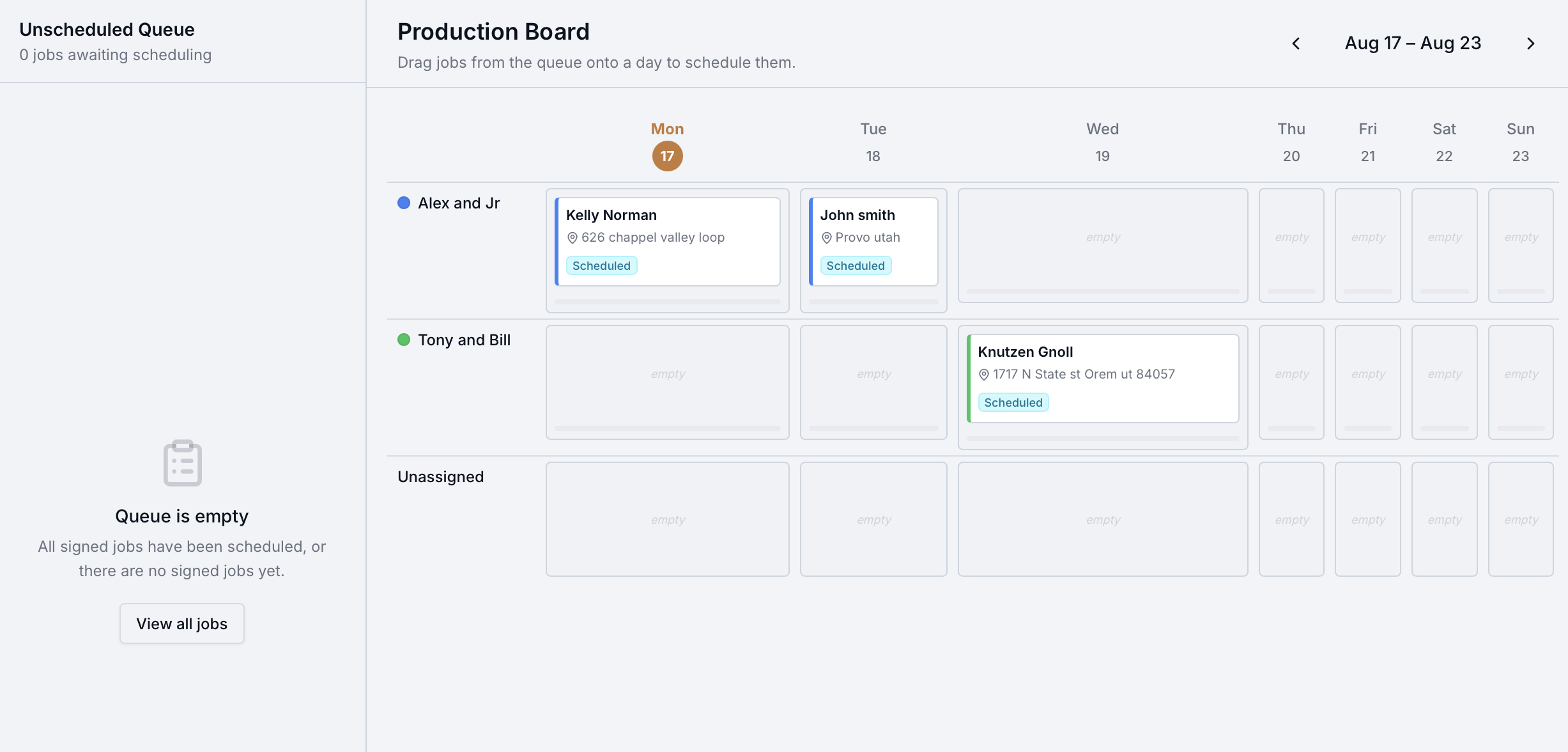 GutterAxis Production Board showing signed jobs assigned to named crews across a weekly calendar